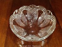 Top and inside view of the clear glass bowl showing scalloped edge and etched leaf pattern
