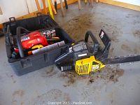 Two chainsaws shown: Homelite in case with orange and yellow control parts, MAC 3200 yellow and black chainsaw out of case on concrete floor.