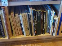 Books arranged on shelves showing titles such as 'The Best of the New Yorker', Logan West and others on history and cultural topics.