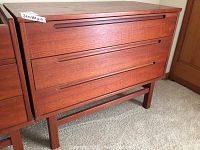 Front view of the three-drawer dresser showing overall condition and design.