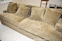 Full view of the suede sofa showing overall size, color, and cushion arrangement