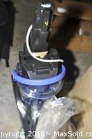 Close up of Hoover Steamvac V-2 unassembled carpet cleaner main body showing blue transparent dirt container and handle attachment point.