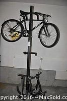 Front view of bike mounted on indoor rack showing overall condition and components.