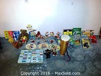 Full assortment of items including Snow White cardboard cutouts, matchbox cars case, plush and plastic toys, and books.