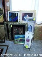 Various framed art pieces including 3D art, political art, farmhouse scenes, and four vertical bottle-themed artworks.