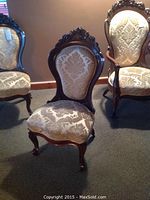 Front view of chair with two matching chairs in background