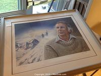 Framed print showing Sir Edmund Hillary in sweater with Everest climbers in background.