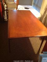 Full view of table top and legs from one end