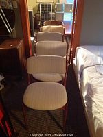 Four straight-back chairs front view