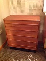 Full front view of teak veneer highboy dresser showing five drawers and overall condition