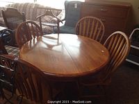 Full view of table with four chairs surrounding