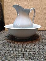 Side view of jug and wash basin showing size and decorative detail