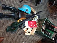 Full overview of the tool collection including cordless devices, safety helmet, and assorted hand tools.