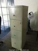 Side view of beige metal filing cabinet showing 4 drawers and lock