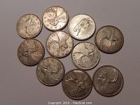 Top side of all ten Canadian silver quarters showing the caribou design and years.