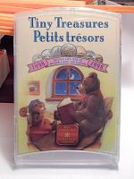 Photo of the front plastic case with bear illustration and set title 'Tiny Treasures Petits trésors 1998' and uncirculated coin set label.