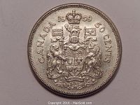 Obverse side of the 1959 Canadian 50 cent silver coin showing the detailed coat of arms.
