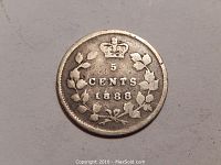 Image of the obverse side of the 1888 Canada five cent silver coin showing denomination, year, crown, and maple leaf wreath.
