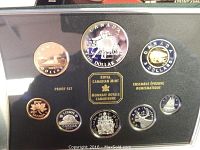 Front view of 2001 Canadian proof coin set showcasing the full set with their designs including National Ballet on the 1 dollar coin and polar bear on the 2 dollars coin.