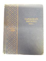 Front cover of vintage blue binder titled Canadian Nickels 1922- with gold embossed lettering and vertical decorative strip on left spine.