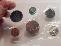 Front view of the sealed 1981 Canadian coin proof set showing all six coins secured in individual pockets of clear plastic.