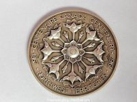 Front view of the large 1967 Canada Centennial Northwest Territories medallion showing detailed floral design and text around the edge.
