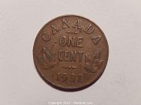 Close-up photo of the obverse side of the 1931 Canada one cent coin showing the 'CANADA ONE CENT 1931' text and maple leaf details.