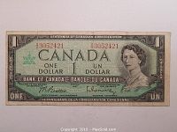 Front side of the 1967 Canadian one dollar bill showing serial number, Queen Elizabeth II portrait, bilingual text, signatures, and Centennial design elements.