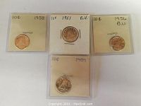 Four Canadian dimes, each encased in protective holders with handwritten date and denomination notes visible. Coins dated 1956, 1958, 1959, and 1961.