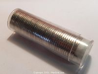 Plastic tube filled with a large roll of silver-colored 1967 Canadian nickels.