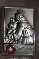 Front view of the rectangular metal plaque depicting St. Anthony holding baby Jesus with the embedded relic visible at the bottom left.