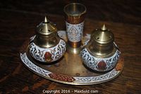 Front angled view of the full set showing the tray, salt and pepper shakers, and toothpick holder on a dark surface