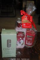 Photo of Bath & Body Works Winter Candy Apple set including body lotion and candle, and Clinique facial soap in green box with dish.