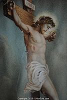 Close-up of Jesus Christ on the cross showing detailed depiction of his face, crown of thorns, wounds and loincloth.