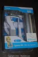 Wii Sports Kit packaging showing the contents including white plastic sports attachments for Wii controller