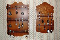 Both wooden racks fully visible with spoons displayed. Shows variety of spoons and condition.