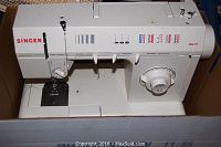 Front and top view of white Singer electronic control sewing machine showing stitch pattern options and control knobs.