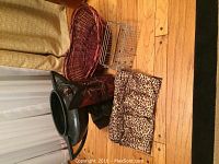 Lot of home decor items including large urn, two baskets, wooden mask and leopard shoe storage