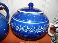 Close-up of large blue-dotted soup tureen with lid showing white floral swirl decoration and classic Burgel Keramik pattern