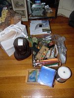 Overview of assorted decor items including CDs, mahogany Rasta sculpture, silk lanterns, and solar-powered lantern boxes.