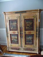 Full front view of armoire showing painted panels