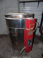 Full view of kiln showing stainless steel body and red control box