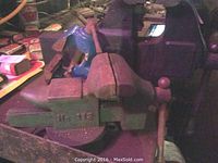 Two medium and large bench vices side by side showing jaw faces and mounting base