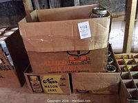 Box labeled Kerr Mason Jars showing packaging with many jars inside and some jars stacked on top