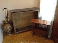 Full view of the display shelf, magazine table, and umbrella stand together showing scale and finish.
