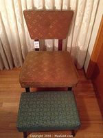 Front view of 1950's hostess chair and foot stool showing upholstery and leg styles.