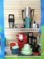 Shelf with various coffee and kitchen items including Salton EX 8 cappuccino maker, Cory coffee pot, mugs, thermos, pottery and baking dishes.