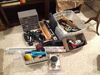 General overview of drills, organizer, bins, and accessories on carpet