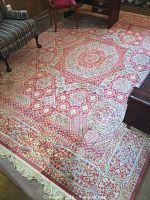 Full view of rug laid on hardwood floor with furniture partially on top