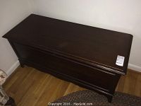 Closed view of the Lane cedar chest showing dark wood finish and decorative bottom molding